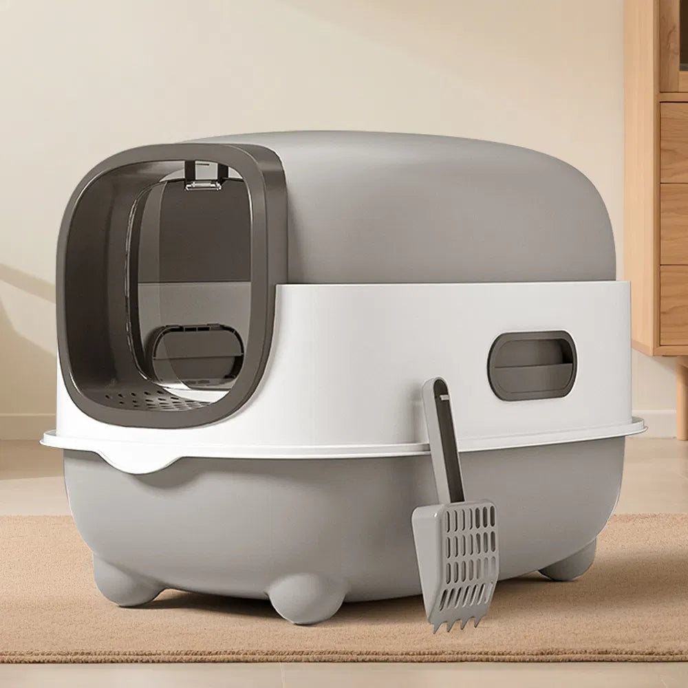 Gray enclosed cat litter box with elevated base, side view