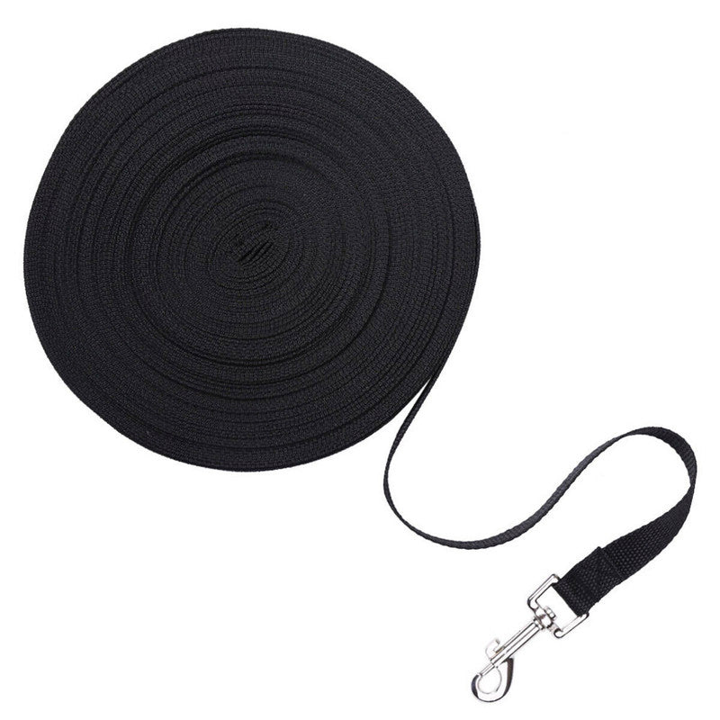 black long dog training leash coiled with metal swivel clip on white background