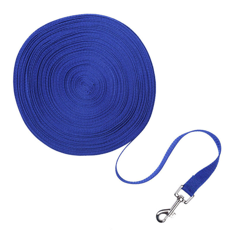 blue long dog training leash coiled with metal swivel clip and handle on white background