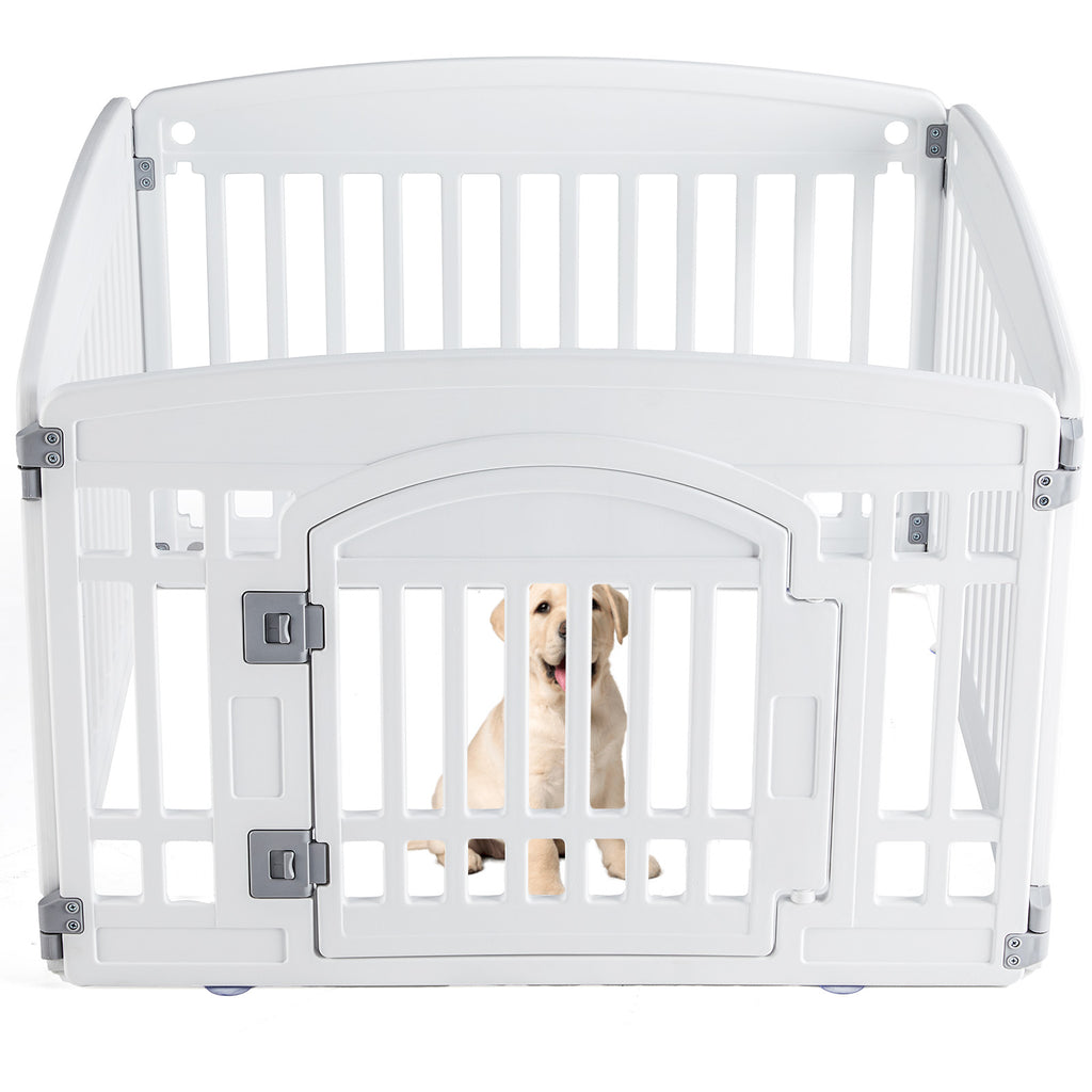 White plastic dog playpen with vertical slats and arched gate door; golden retriever puppy sitting inside the indoor pet fence