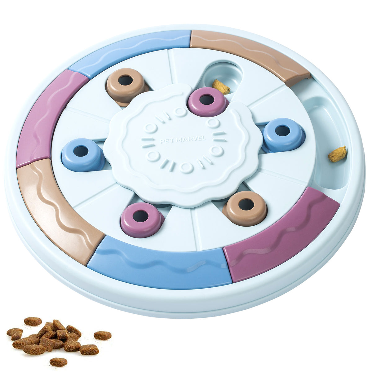 Close-up of the round pastel puzzle with light-blue base, colored sliding tiles, and treat compartments with holes, with kibble beside it.