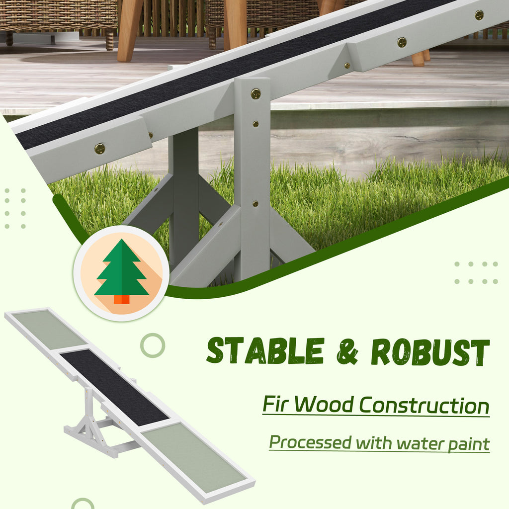 Side view of white wooden dog agility training seesaw