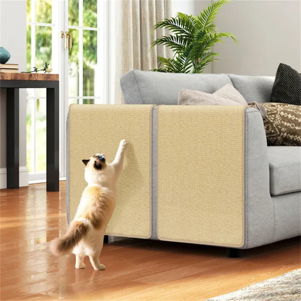 Cat scratching sisal mats draped over sofa arm – protects furniture, fluffy cat using scratching pad