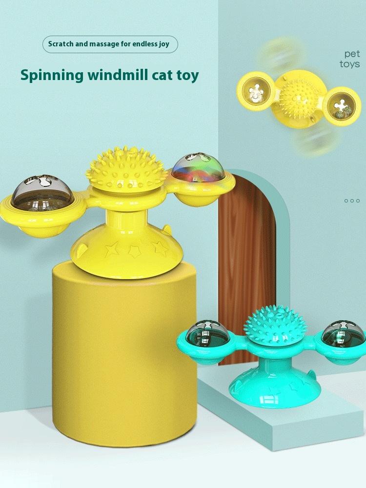 Close-up product card of the yellow and turquoise spinning windmill cat toys showing the spiky massage ball and ball domes in detail.